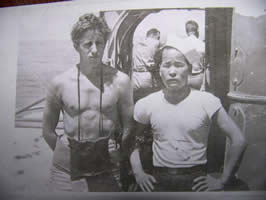 Fred Voskuhl posing with captured Japanese CPO named Yanabi