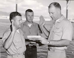 Chief Radioman Edward Brown, Boat Yeoman Olszewski, and Commanding Officer, Doug Stahl Reenlistment Ceremony.